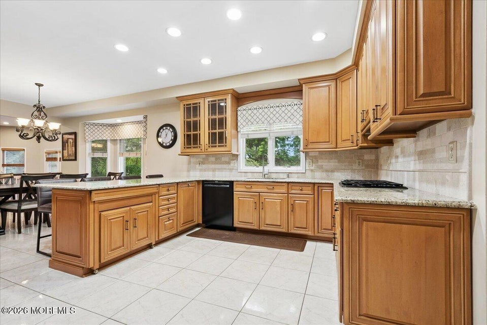Luxury kitchen with granite countertops and Sub-Zero refrigerator