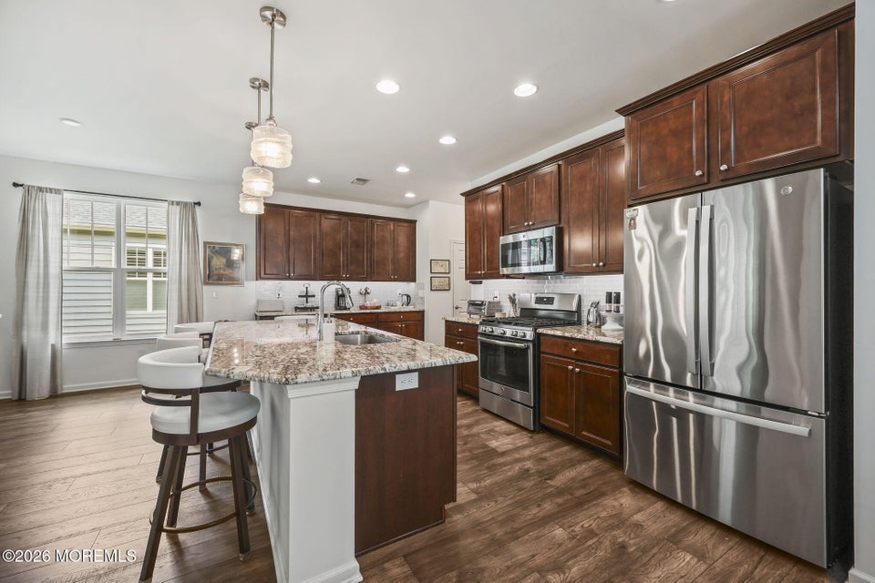 Upgraded kitchen with granite countertops and center island